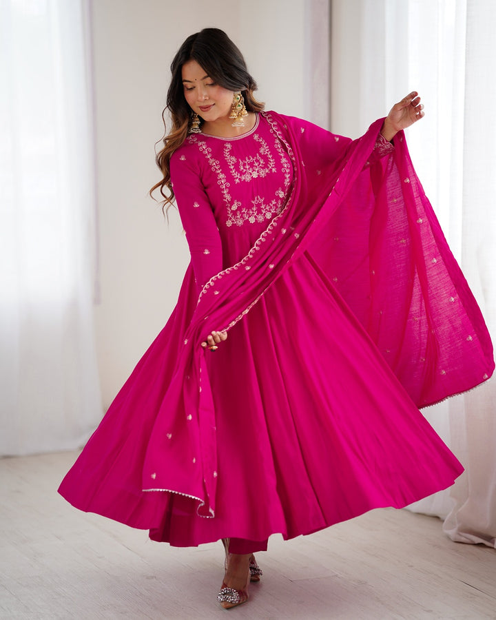 Rani pink Chanderi silk three-piece Anarkali suit with elegant flare and rich finish—perfect for weddings and festive occasions.