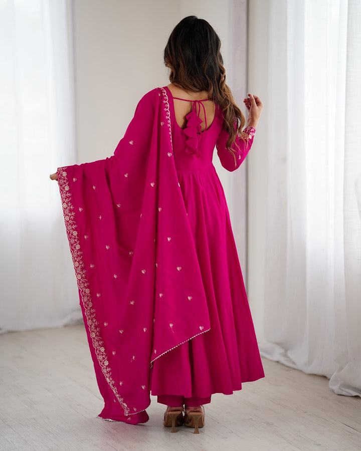 Rani pink Chanderi silk three-piece Anarkali suit with elegant flare and rich finish—perfect for weddings and festive occasions.