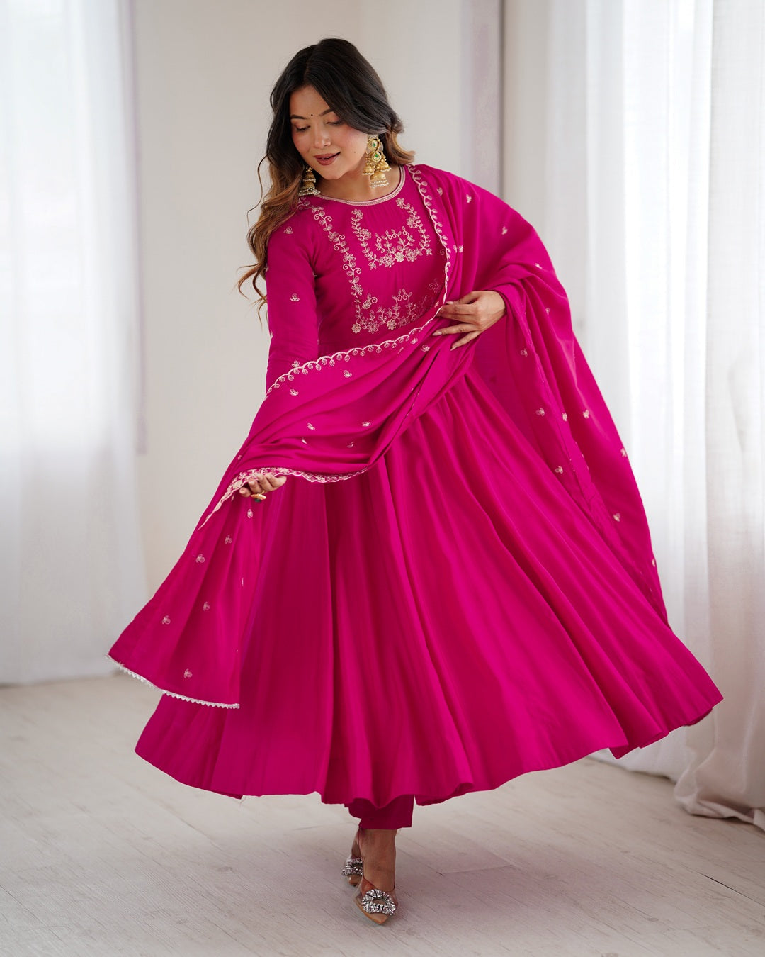 Rani pink Chanderi silk three-piece Anarkali suit with elegant flare and rich finish—perfect for weddings and festive occasions.