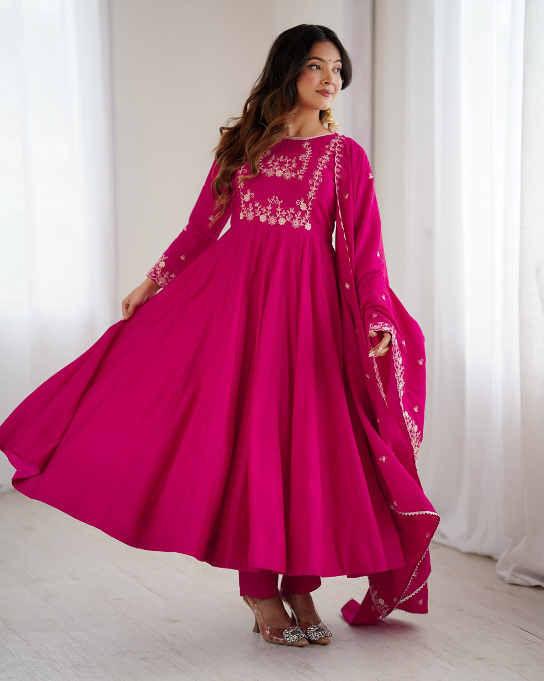 Rani pink Chanderi silk three-piece Anarkali suit with elegant flare and rich finish—perfect for weddings and festive occasions.