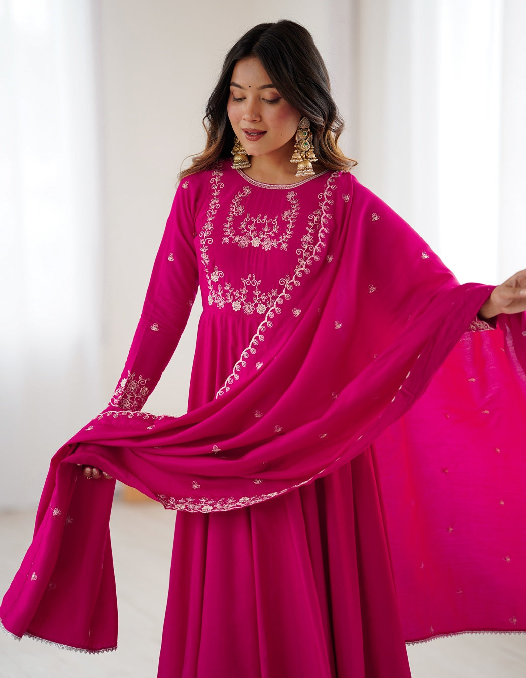 Rani pink Chanderi silk three-piece Anarkali suit with elegant flare and rich finish—perfect for weddings and festive occasions.