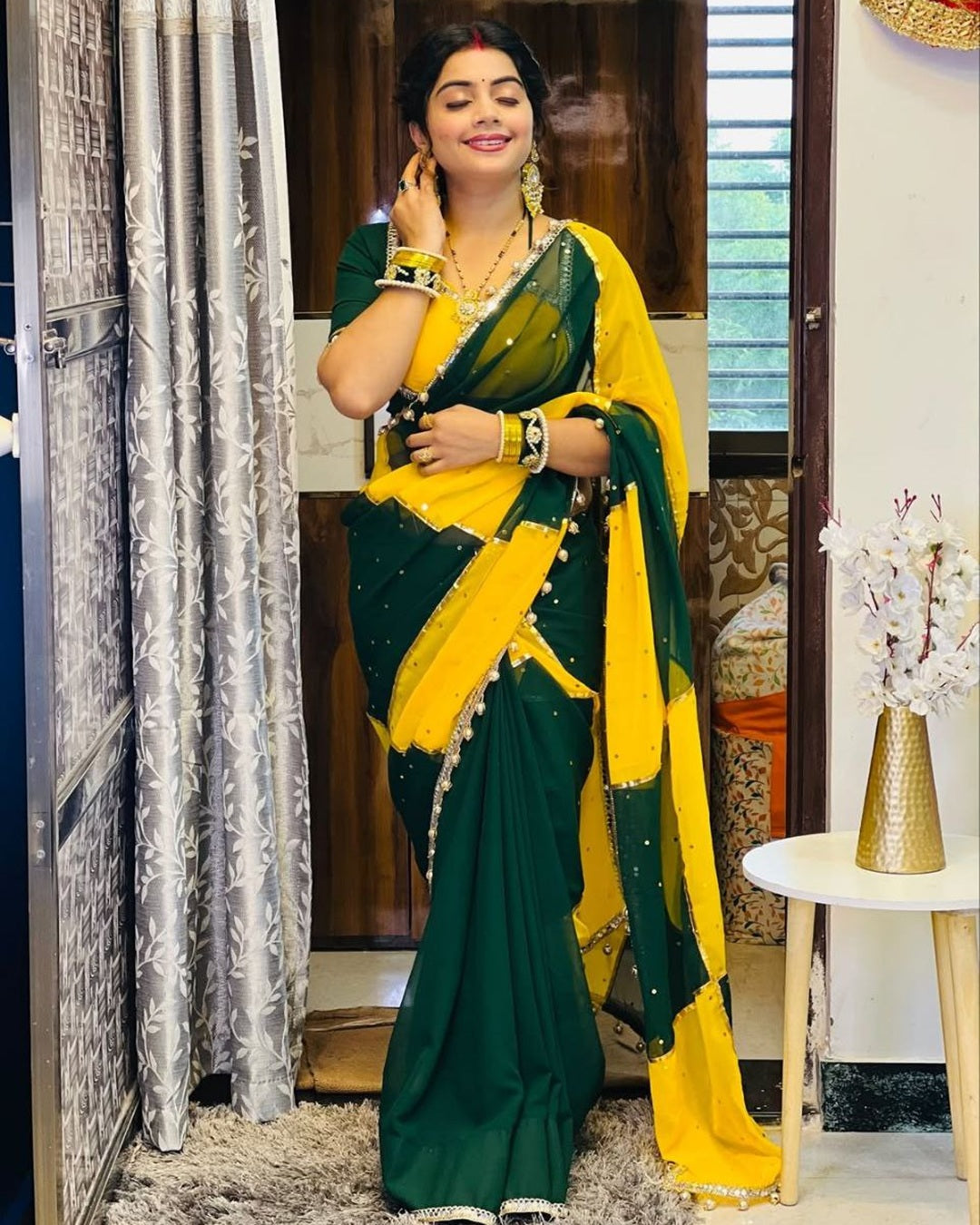 Green & Yellow georgette saree with box design, mirror work & gotta lace border – perfect for festive wear.