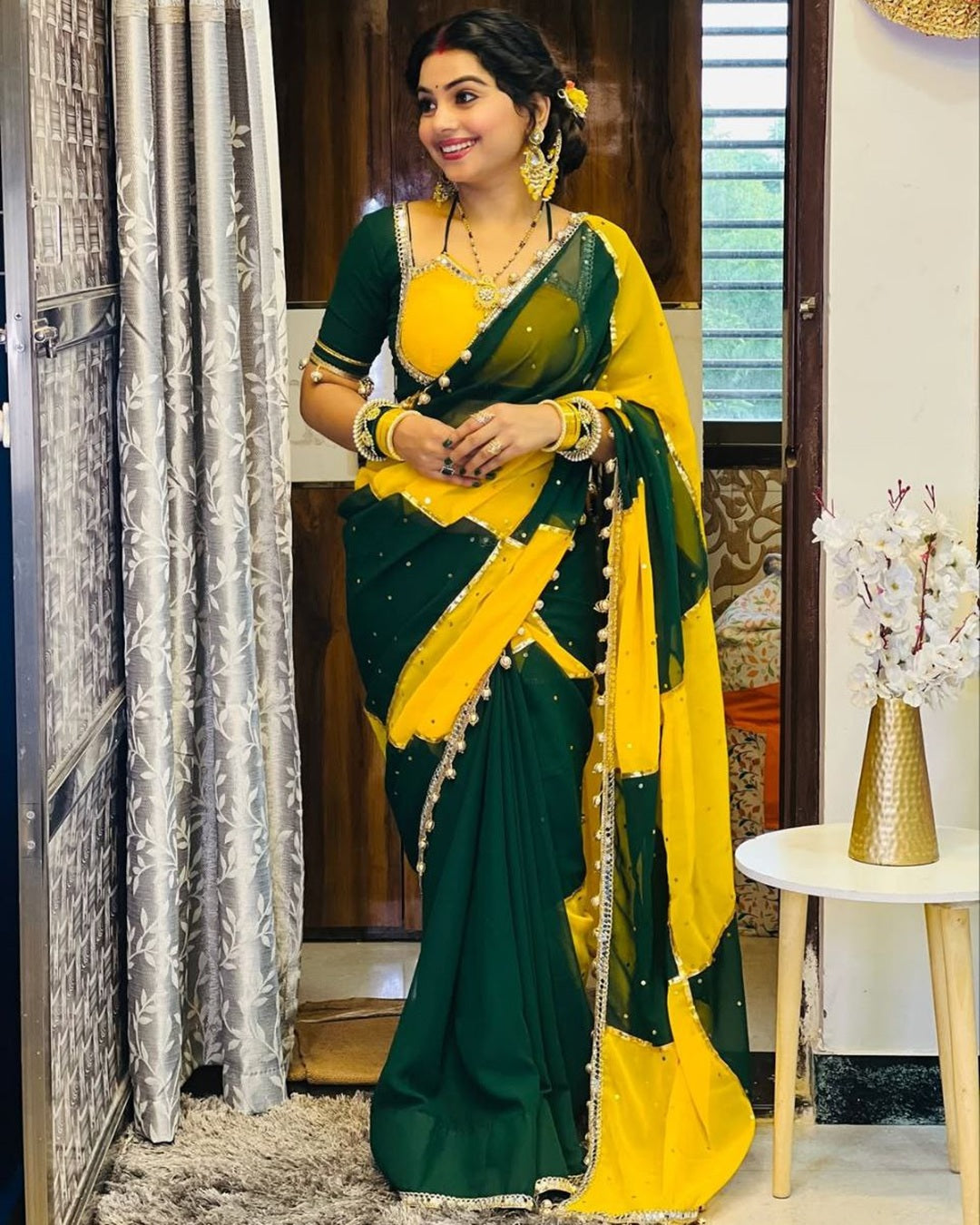 Green & Yellow georgette saree with box design, mirror work & gotta lace border – perfect for festive wear.