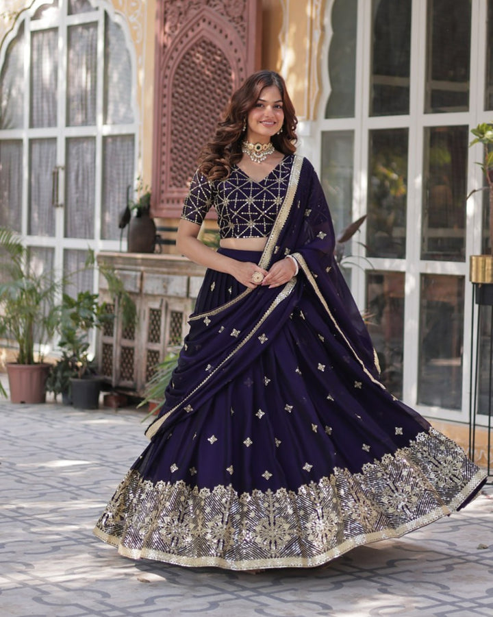 Dark Purple Color Rangoli Silk Embroidered Lehenga Choli