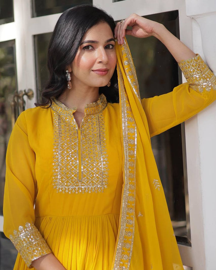 Yellow Color Faux Blooming Rich Embroidered Work Gown